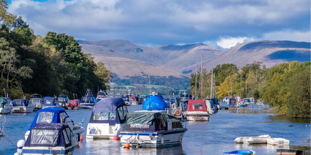 Boats floating in Balloch harbour at Loch Lomond