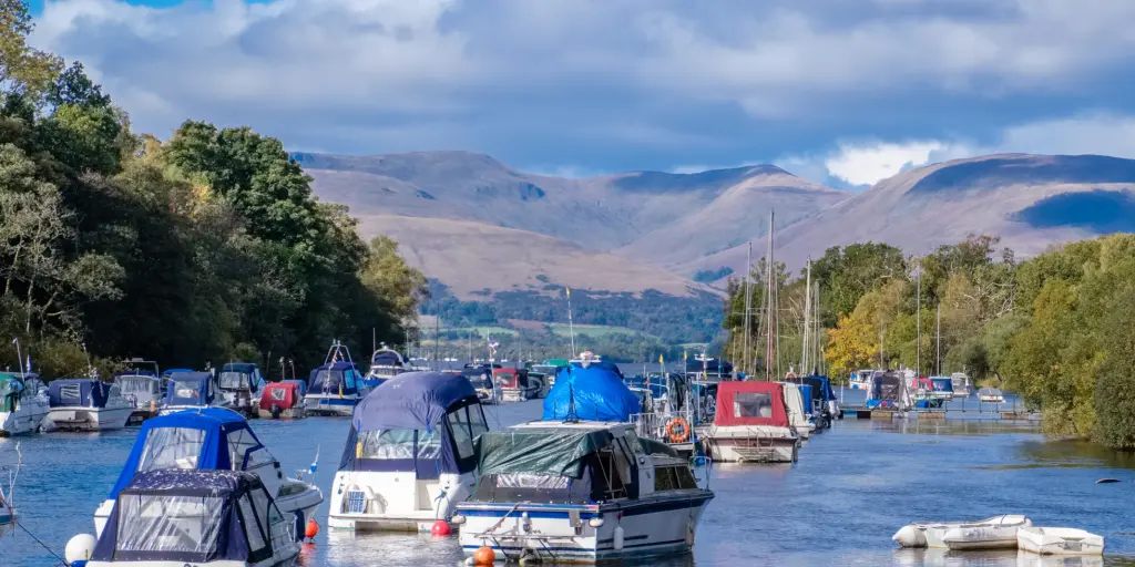Boats floating in Balloch harbour at Loch Lomond