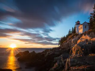 Acadia National Park, Maine, USA with a view of the Bass Harbor Lighthouse at sunset.