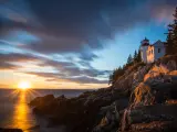 Acadia National Park, Maine, USA with a view of the Bass Harbor Lighthouse at sunset.