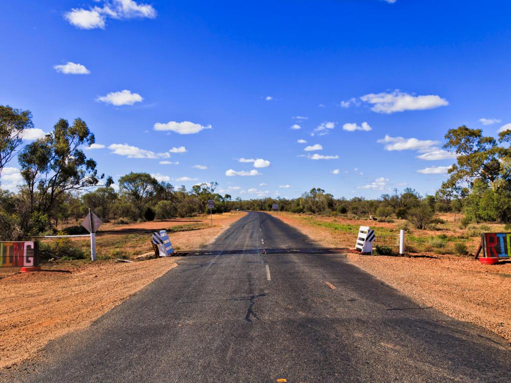 Entry signposts for Lightning Ridge's opal mines in the Australian outback, a full day's road trip from Sydney