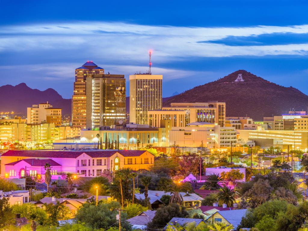 Tucson, Arizona, USA with the downtown skyline with Sentinel Peak at dusk and the mountaintop A for Arizona.