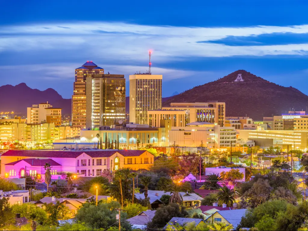 Tucson, Arizona, USA with the downtown skyline with Sentinel Peak at dusk and the mountaintop A for Arizona.