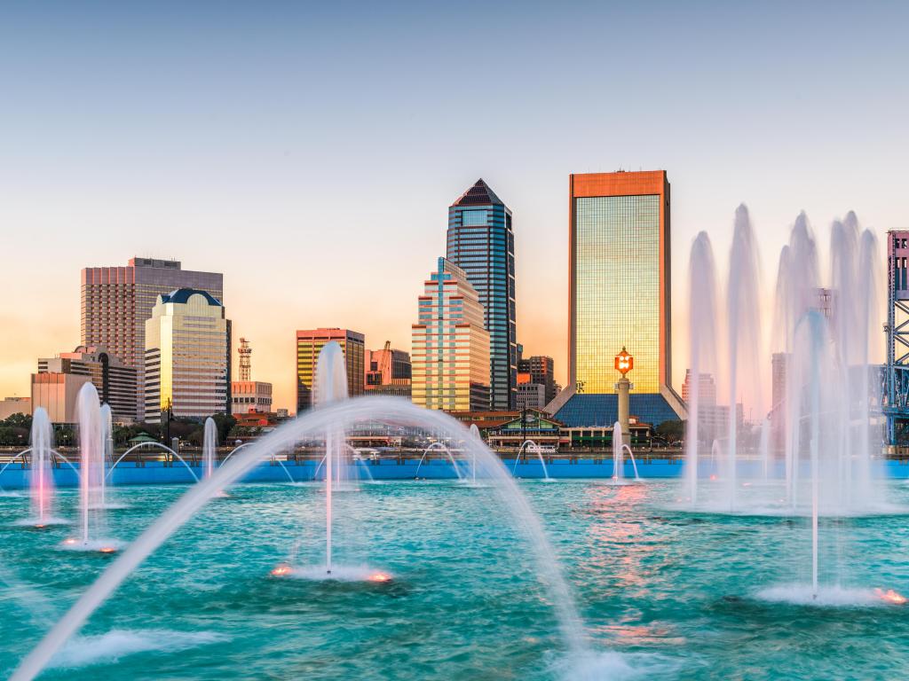 Jacksonville, Florida, USA and skyline with water fountains the foreground and taken at early sunset.