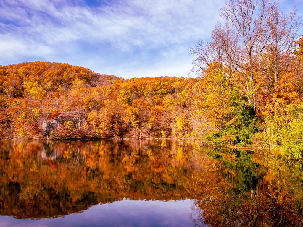 A lake in Bear Mountain State Park, reflecting the autumn foliage of the trees that surround it