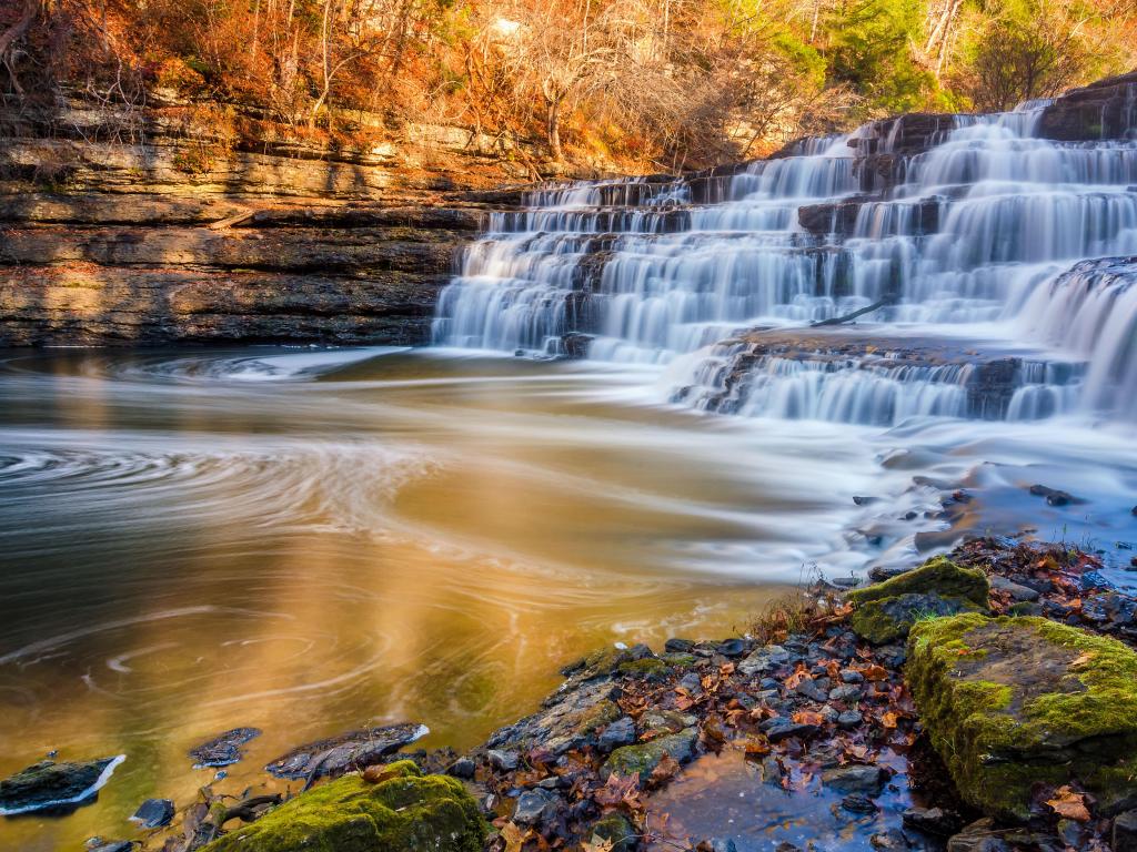 Burgess Falls State Park, Tennessee, USA with silky water cascades over limestone rock at Burgess Falls State Park at fall. 