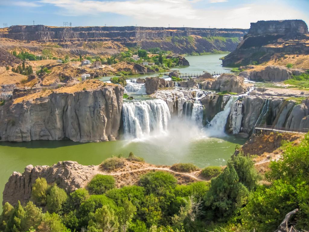 Shoshone Falls, Idaho, USA taken as a spectacular aerial view of Shoshone Falls or Niagara of the West with Snake River in the foreground on a sunny day.
