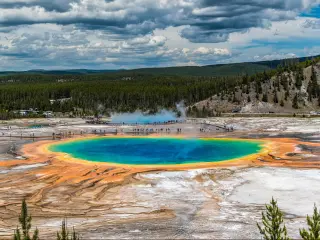 Grand Prismatic Springs and geyser basin landscape at Yellowstone National Park.