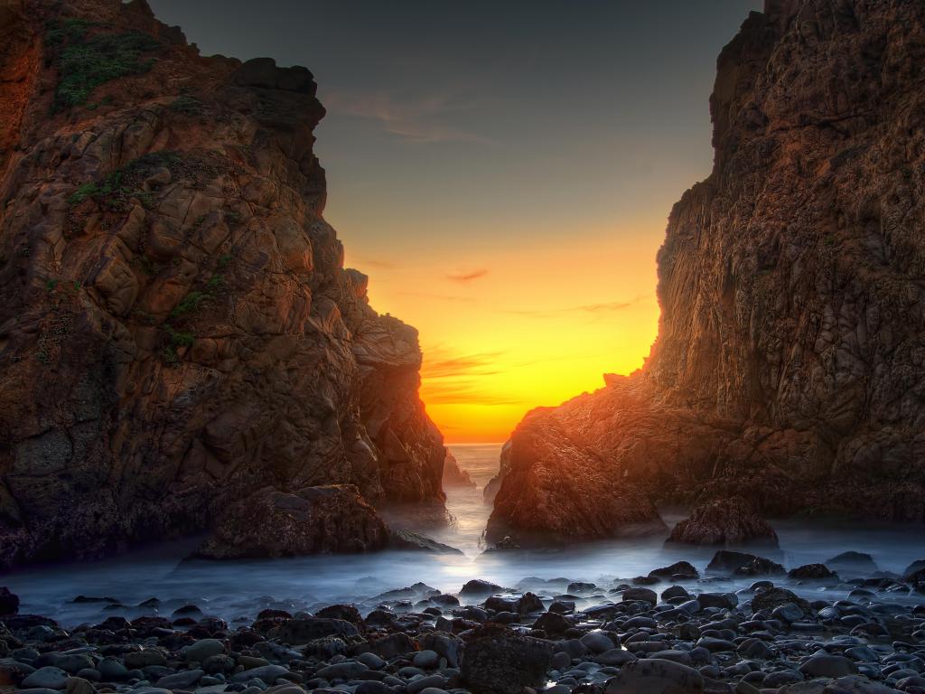 Pfeiffer Big Sur State Park, California, USA taken at Pfeiffer Beach in Big Sur at sunset with rocky formations either side.