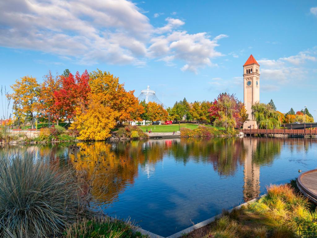 Fall colors envelop the area around the clock tower and pavilion by the Spokane River at Riverfront Park
