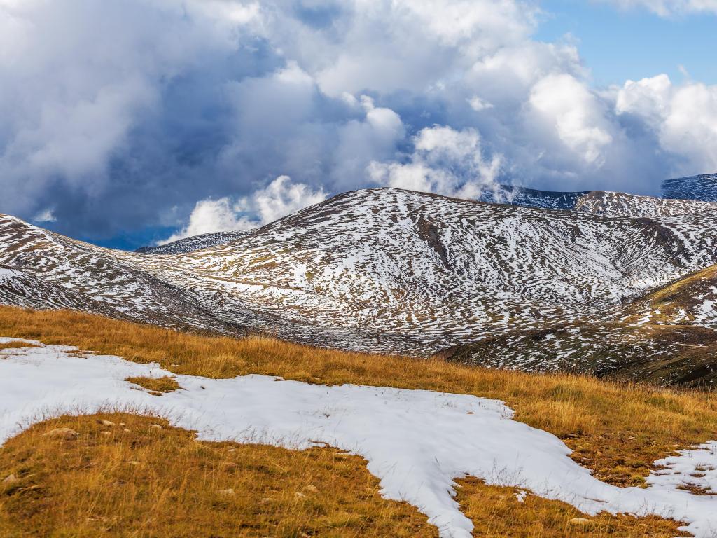 Mount Kosciuszko National Park, Australia with patches of snow building up on slopes of Snowy Mountains at Mount Kosciuszko National Park, Australia