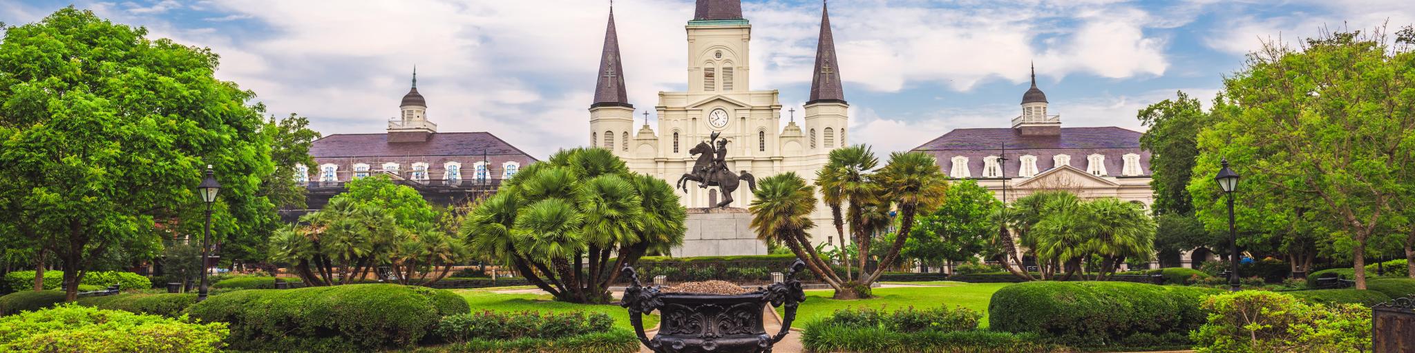 New Orleans, Louisiana, USA at Jackson Square and St. Louis Cathedral in the morning on a sunny day.