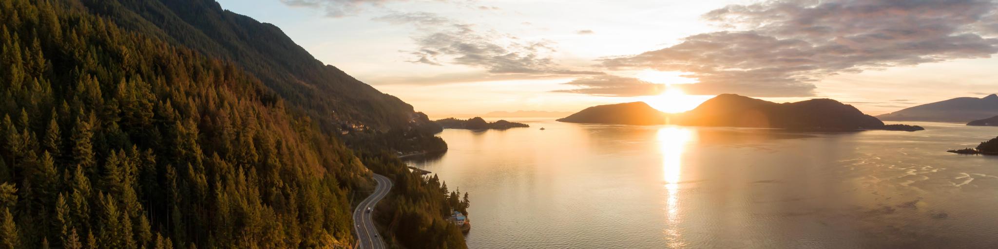 The Sea to Sky Highway, West Vancouver, British Columbia, Canada with a view of Horseshoe Bay take as an aerial panoramic view during a colorful sunset in Fall season.