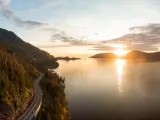The Sea to Sky Highway, West Vancouver, British Columbia, Canada with a view of Horseshoe Bay take as an aerial panoramic view during a colorful sunset in Fall season.