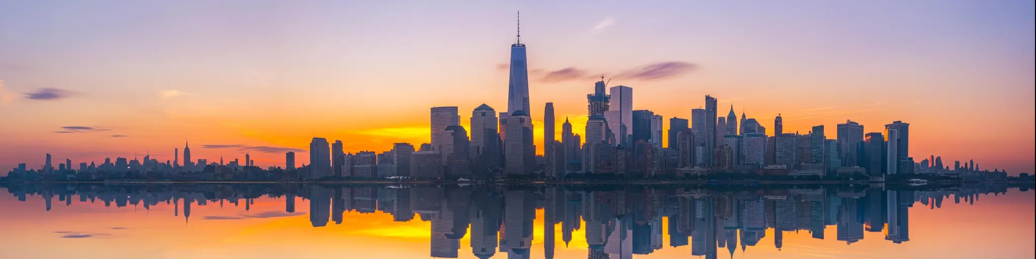 NYC skyline reflected in the water in pastel colors