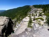 Winding rockface and dense forests along Chilnualna Falls Hike in Yosemite National Park 