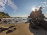 Redwood National Parks, California, USA with a view of a huge sandy beach with large stones. 