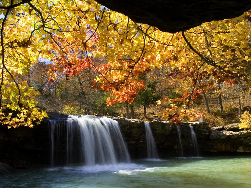Ozark National Forest, Arkansas, USA with autumn surrounding Falling Water Falls with spectacular fall colors on the leaves.