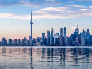View of high rise buildings of Toronto across Lake Ontario in silvery light