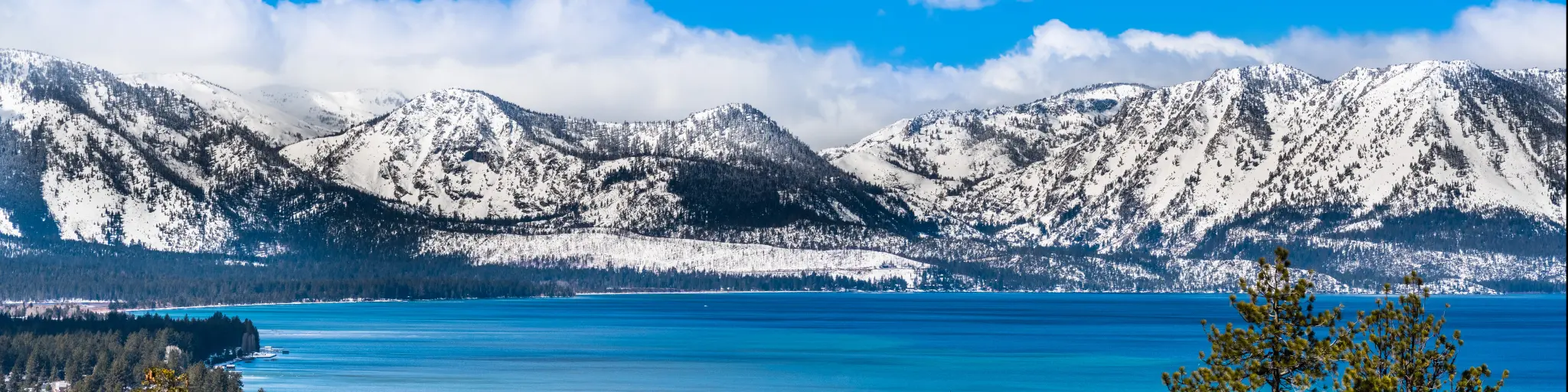 Snow capped Sierra Nevada Mountains behind Lake Tahoe, California