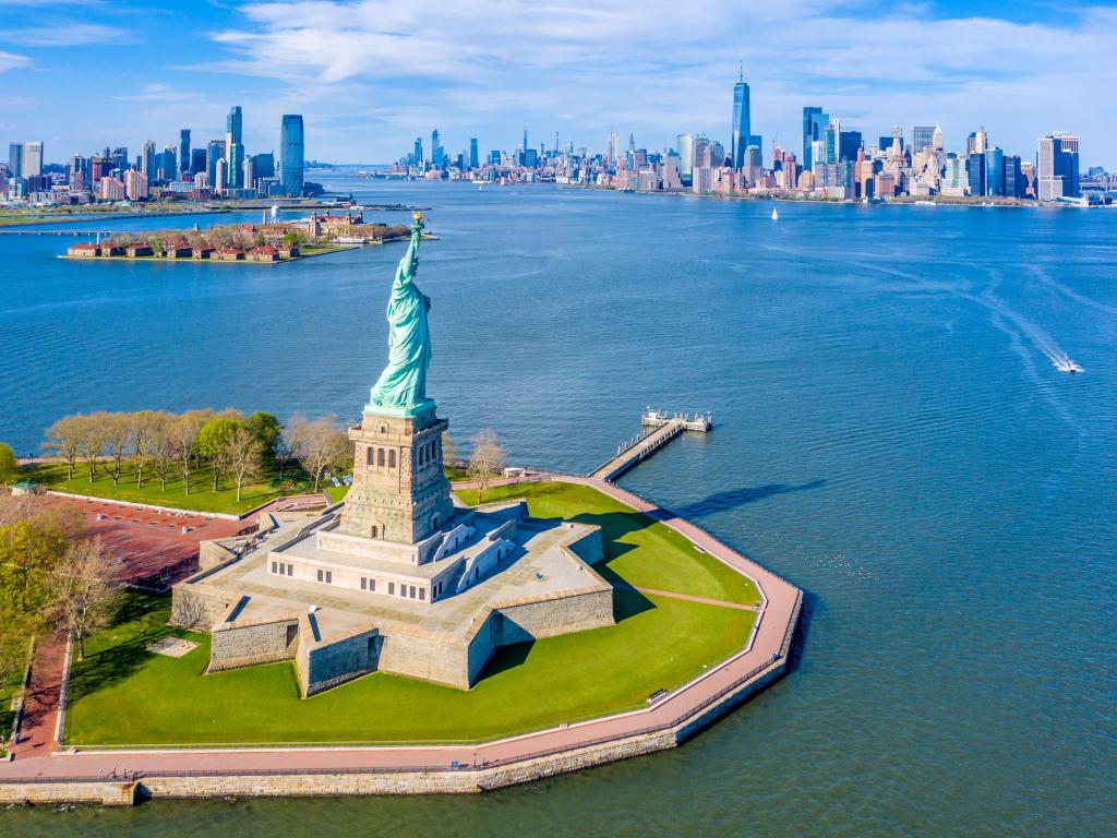 Aerial View of Statue of Liberty, Ellis Island and Lower Manhattan Skyline from New York Harbor near Liberty State Park in New Jersey