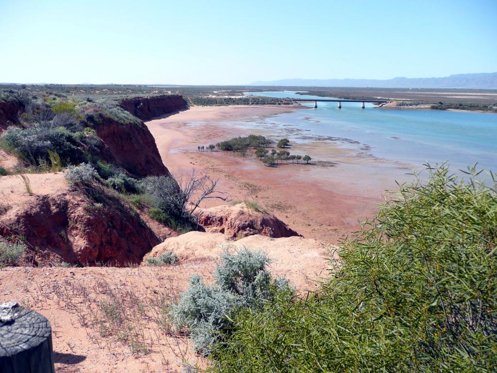 Spencer Gulf, Australia looking down to the dunes below and river beyond with Port Augusta in the distance.