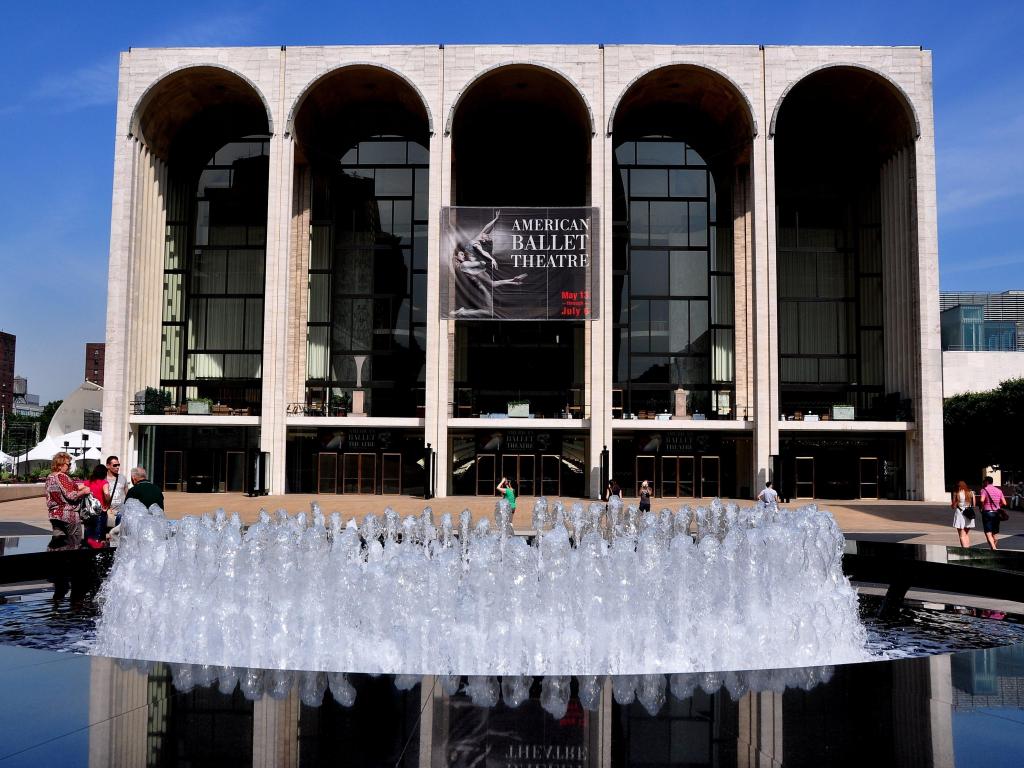 Outside view of The Metropolitan Opera House and Josie Robertson Plaza's fountain at Lincoln Center for the Performing Arts