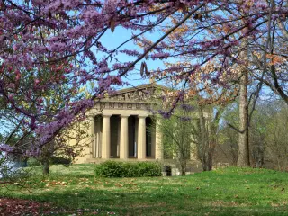 Parthenon replica in Nashville in the spring, framed by blossoming branches