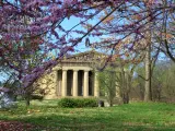 Parthenon replica in Nashville in the spring, framed by blossoming branches