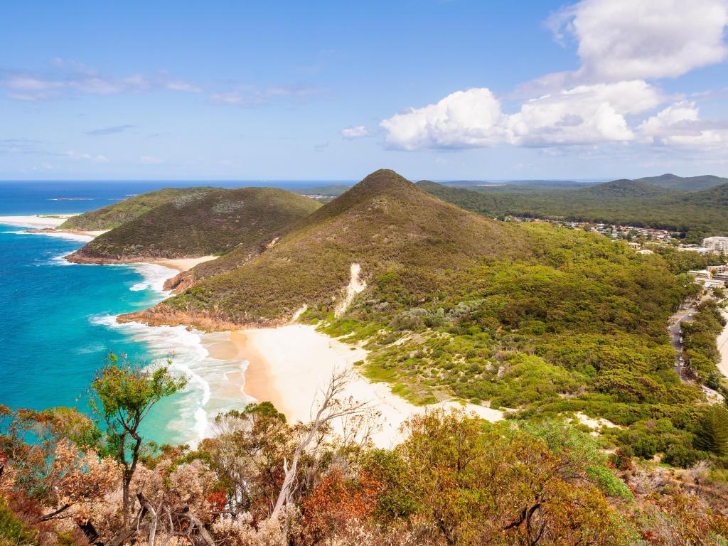 Tomaree Mountain Lookout - Shoal Bay, NSW, Australia with sweeping views over Zenith Beach and Shoal Bay on a clear sunny day.