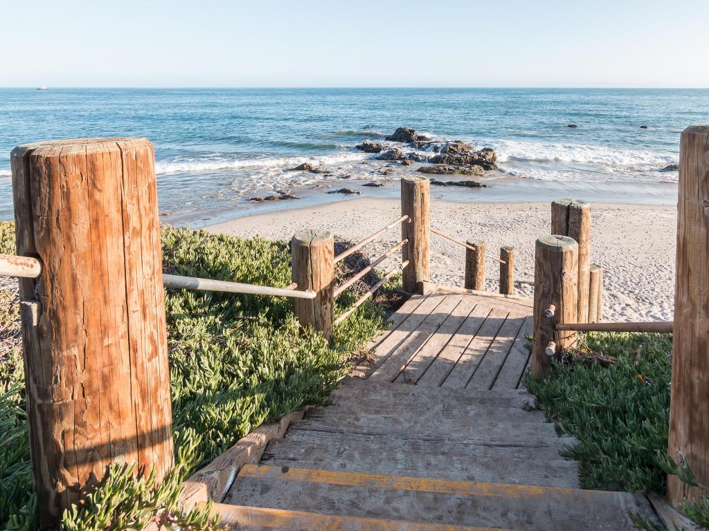 Stairs leading down to the beach and Pacific ocean at Carpinteria State Beach, California.
