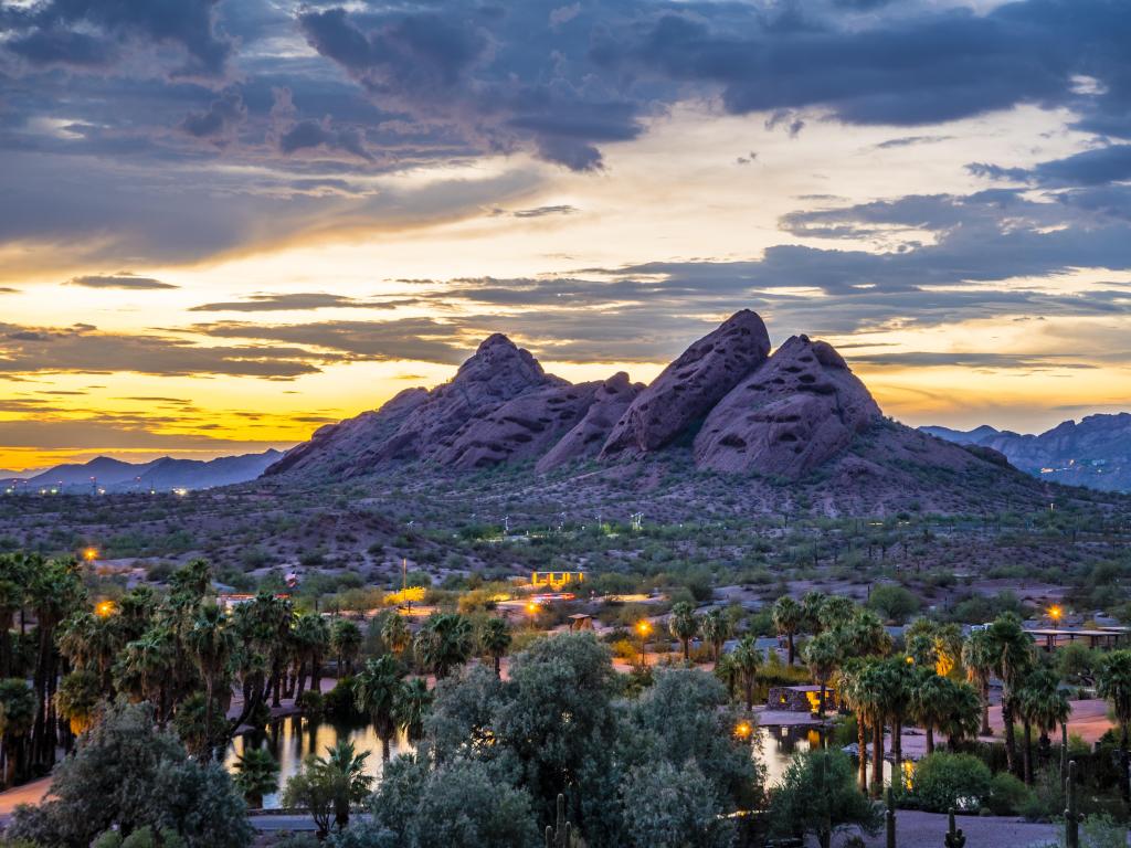 Phoenix, Arizona, USA with a view of the red sandstone buttes of Papago Park after sunset.