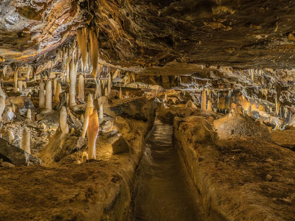 A path through the Ohio Caverns cave complex with stalactite and stalagmite rock formations