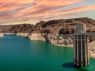 Panoramic photograph of Hoover Dam at sunset with low water level