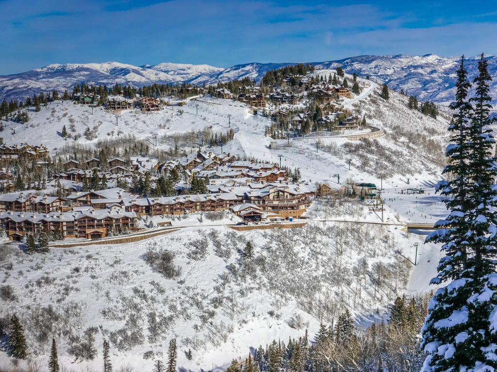 Deer Valley Ski Resort, Utah, USA taken at the Wasatch Mountain Range viewed from the top of the Deer Valley Ski Resort looking down on the chalets and snow on a winter's day.