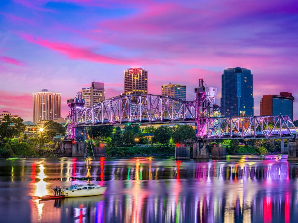 Little Rock, Arkansas, USA downtown skyline on the Arkansas River at night.