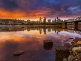 Portland, Oregon, USA a beautiful sunset over the downtown waterfront along Willamette River from Eastbank Esplanade.