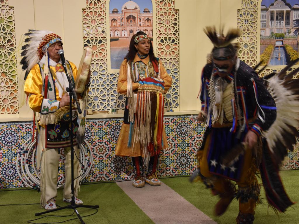 Native American performers at the museum, dancing and playing instruments