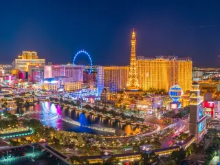 Las Vegas Strip with hotels and casinos lit up and the Bellagio Fountain at night