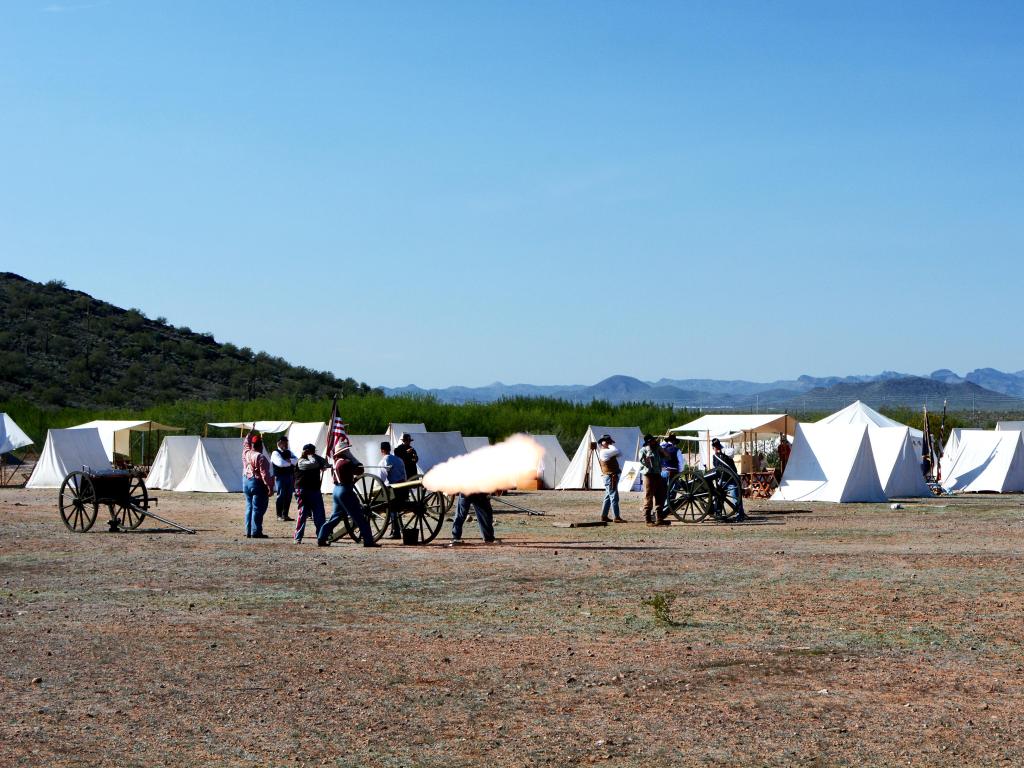 Civil War Battle reenactment with tents and cannons
