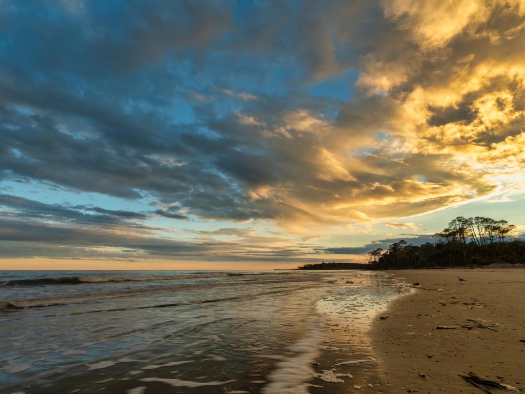 A beautiful sunset reflects the light on the Atlantic Ocean at Hunting Island State Park on St. Helena Island near Beaufort, South Carolina