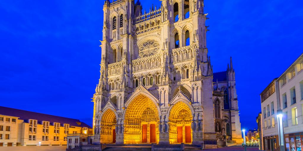 The outisde of Amiens Cathedral, France, lit up at night  