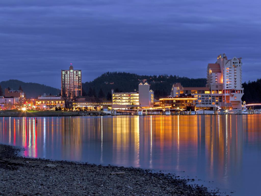 Coeur d'Alene, Idaho, USA taken at downtown Coeur d'Alene in the evening with water in the foreground and the city in the background. 