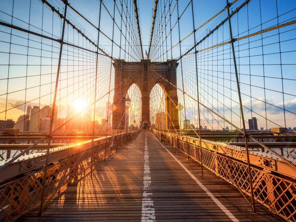 Brooklyn Bridge in New York City, USA, during sunset.