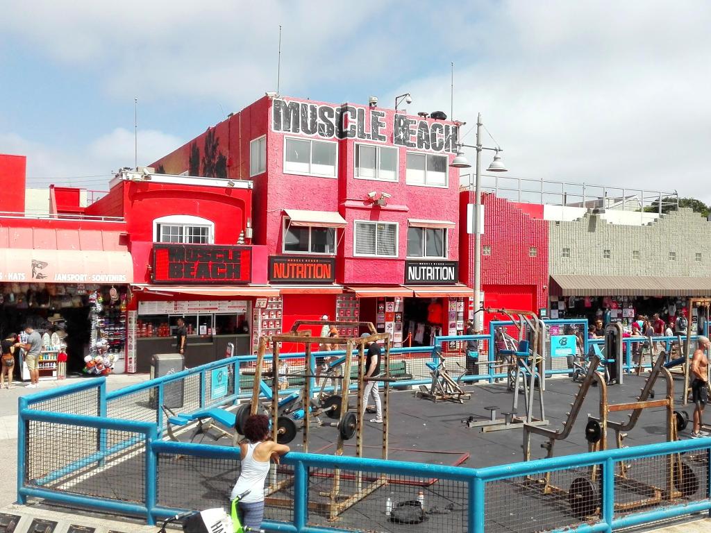 View of iconic Muscle Beach, with visitors working out along the Venice Beach Boardwalk