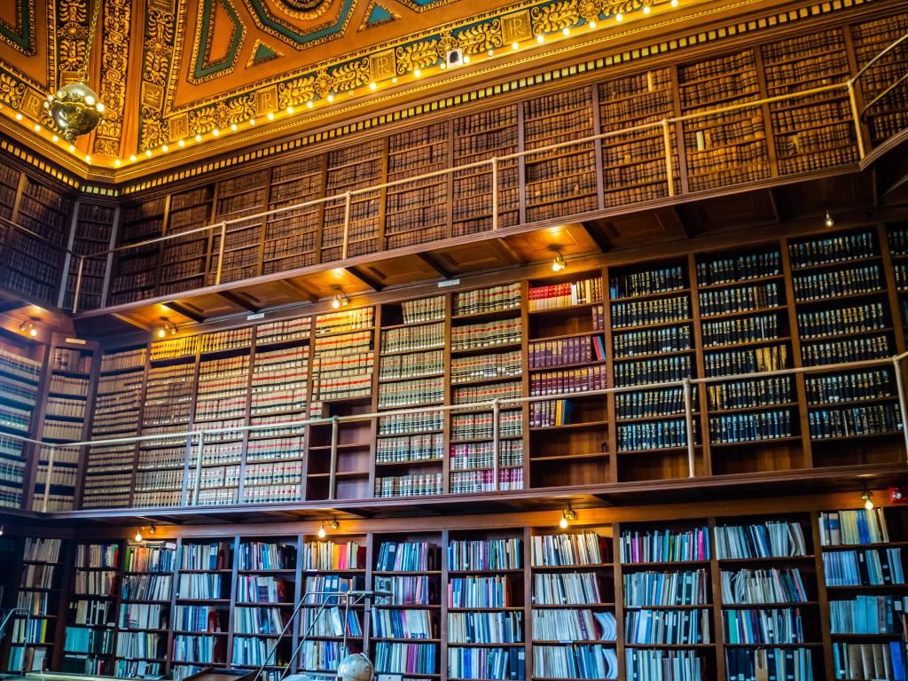 Book shelves line the walls of the grand, historic Rhode Island State Library in Providence