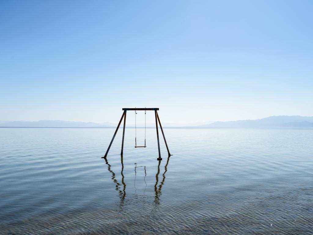 An abandoned rusty swing at Bombay beach in Salton Sea, California.