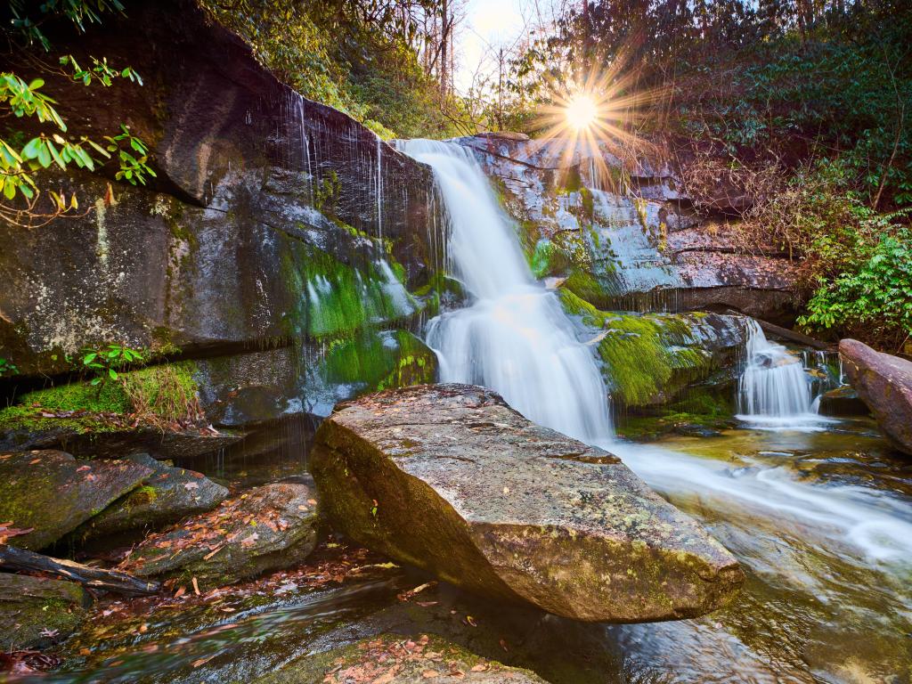 Pisgah National Forest, North Carolina, USA with the sun setting over Cedar Rock Falls.