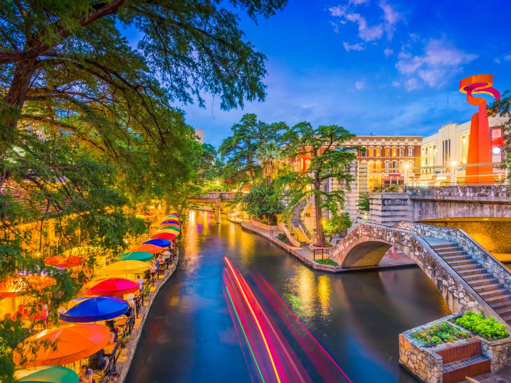 San Antonio, Texas, USA cityscape at the River Walk with colorful umbrellas at early evening. 