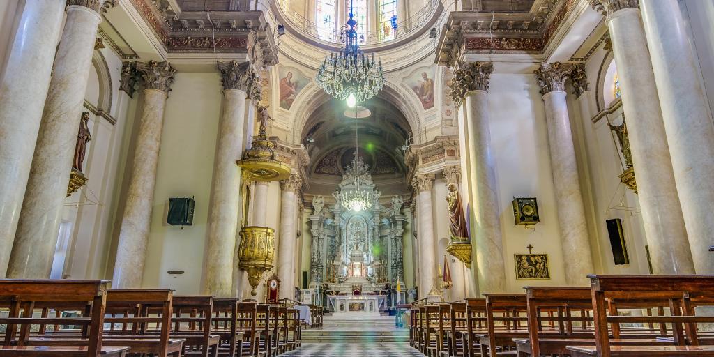 Looking down the nave at the Cathedral Basilica of Our Lady of the Rosary in Rosario, Argentina, towards a domed ceiling